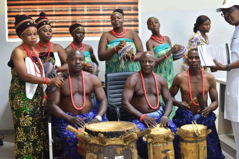 Traditional entertainers performing at the event in Benin